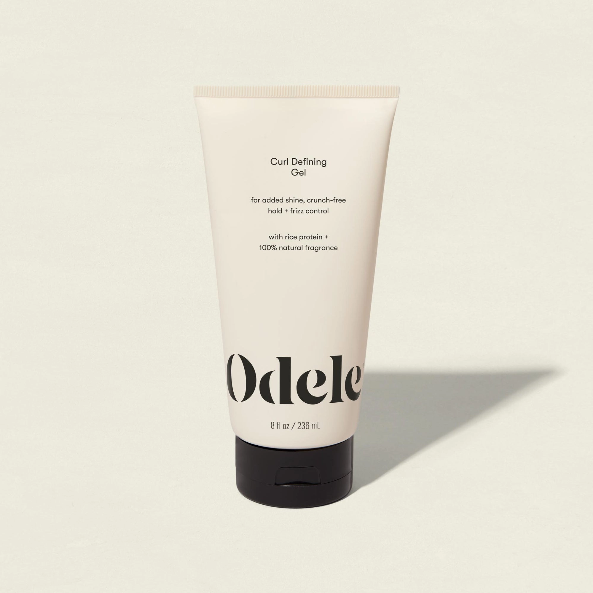 An upright tube of Odele Curl Defining Gel on a light background